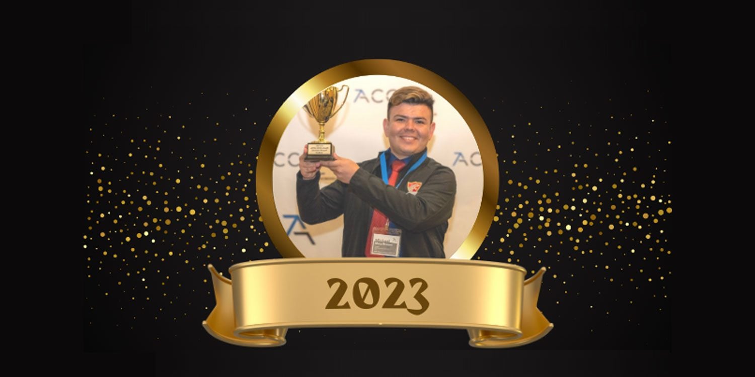 Smiling adult holds a golden trophy, with a "2023" banner below.